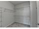Walk-in closet with wire shelving to provide ample storage for clothes and accessories at 3360 Pickens St, Duluth, GA 30096