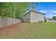 Spacious backyard featuring lawn, trees, and fence at 7459 Old Chapel, South Fulton, GA 30349