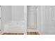 Bathroom featuring a soaking tub and separate glass shower at 7459 Old Chapel, South Fulton, GA 30349