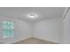 Bedroom with a window, carpeted floors, and white walls at 7459 Old Chapel, South Fulton, GA 30349