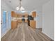 Well-lit kitchen features hardwood floors, modern appliances, and ample counter space for cooking at 7459 Old Chapel, South Fulton, GA 30349