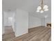 Open living room and dining area with hardwood floors, fireplace, and chandelier at 7459 Old Chapel, South Fulton, GA 30349