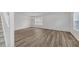 Open living area with hardwood flooring and large windows allowing ample natural light at 7459 Old Chapel, South Fulton, GA 30349