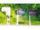 Aerial view of a home showcasing the well-kept lawn, driveway and surrounding neighborhood at 1183 Iron Gate Blvd, Jonesboro, GA 30238