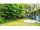 A backyard with mature trees and manicured lawn, offering privacy and an inviting outdoor space at 1183 Iron Gate Blvd, Jonesboro, GA 30238
