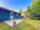 Backyard patio featuring a small concrete pad and view of yard area, offering a private outdoor retreat at 1183 Iron Gate Blvd, Jonesboro, GA 30238