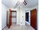 Bedroom featuring a ceiling fan, closet, and adjoining rooms at 1183 Iron Gate Blvd, Jonesboro, GA 30238