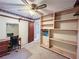 Bedroom with a ceiling fan, built-in shelves, and desk at 1183 Iron Gate Blvd, Jonesboro, GA 30238