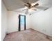 A bedroom with a window, ceiling fan, and floral curtain at 1183 Iron Gate Blvd, Jonesboro, GA 30238