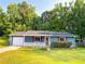 Charming home with a well-maintained lawn, attached garage, and inviting front porch at 1183 Iron Gate Blvd, Jonesboro, GA 30238