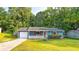 Quaint single-story home with a garage, manicured lawn and charming curb appeal at 1183 Iron Gate Blvd, Jonesboro, GA 30238
