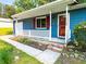 Covered front porch with a white railing and red trim, and brick steps leading to the entrance at 1183 Iron Gate Blvd, Jonesboro, GA 30238