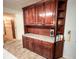 This kitchen features lots of cabinet space and a tile floor at 1183 Iron Gate Blvd, Jonesboro, GA 30238