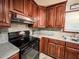 The kitchen features modern appliances, tile floors, and lots of cabinet space at 1183 Iron Gate Blvd, Jonesboro, GA 30238