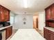 The kitchen features an island, tile floors, and plenty of counter space at 1183 Iron Gate Blvd, Jonesboro, GA 30238