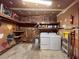 A laundry room with a washer, dryer, and shelves at 1183 Iron Gate Blvd, Jonesboro, GA 30238