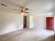 Open living room with view of front entry and ceiling fan at 1183 Iron Gate Blvd, Jonesboro, GA 30238