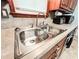 Close-up of double basin kitchen sink with chrome faucet and neutral countertops at 1183 Iron Gate Blvd, Jonesboro, GA 30238