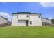Backyard featuring a two-story home and a wooden fence at 12225 Anchor Way, Hampton, GA 30228
