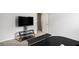 Bedroom featuring a mounted television and a glass shelving unit at 12225 Anchor Way, Hampton, GA 30228