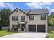 Charming two-story brick home with a two-car garage and well-maintained landscaping at 12225 Anchor Way, Hampton, GA 30228
