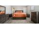 Large carpeted main bedroom with dresser, mirror and natural light at 12225 Anchor Way, Hampton, GA 30228