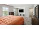 Main bedroom with carpet, TV and two large windows allowing lots of natural light at 12225 Anchor Way, Hampton, GA 30228