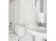 A well-lit bathroom featuring a pedestal sink and a shower/tub combo with a white toilet at 626 Pecan Knoll Dr # 13, Marietta, GA 30008