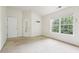 The bedroom offers natural light and neutral carpeting at 626 Pecan Knoll Dr # 13, Marietta, GA 30008