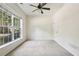 Bright bedroom features a ceiling fan and large windows providing natural light at 626 Pecan Knoll Dr # 13, Marietta, GA 30008