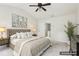 Bedroom boasts neutral decor, ceiling fan, soft carpet, and tufted headboard at 626 Pecan Knoll Dr # 13, Marietta, GA 30008