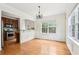 Well-lit dining room boasts hardwood floors and a view into the kitchen at 626 Pecan Knoll Dr # 13, Marietta, GA 30008