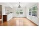 Inviting dining room with chair rail molding, hardwood floors, and natural light at 626 Pecan Knoll Dr # 13, Marietta, GA 30008