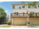 Townhome back exterior showing a deck above a one car garage and a landscaped yard at 626 Pecan Knoll Dr # 13, Marietta, GA 30008
