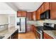 Modern kitchen features stainless steel appliances, granite countertops, and hardwood floors at 626 Pecan Knoll Dr # 13, Marietta, GA 30008
