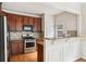 Gourmet kitchen with stainless steel appliances, granite countertops, and a breakfast bar at 626 Pecan Knoll Dr # 13, Marietta, GA 30008