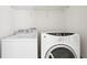 Laundry room features a Whirlpool washer and GE dryer at 626 Pecan Knoll Dr # 13, Marietta, GA 30008