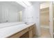 Bright bathroom featuring an extended vanity and a door to the shower at 838 Lake Hollow Sw Blvd, Marietta, GA 30064