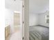 A partial view showing a bathroom with a tub and a bedroom with carpeting at 838 Lake Hollow Sw Blvd, Marietta, GA 30064