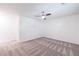 Bedroom featuring neutral paint, carpet, ceiling fan with adjacent bathroom at 838 Lake Hollow Sw Blvd, Marietta, GA 30064