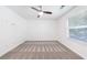 Clean bedroom with neutral walls, carpet, ceiling fan and a bright window at 838 Lake Hollow Sw Blvd, Marietta, GA 30064