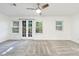 Bright bedroom featuring neutral paint, carpet, ceiling fan and french doors at 838 Lake Hollow Sw Blvd, Marietta, GA 30064