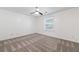 Spacious bedroom with neutral walls, carpet, ceiling fan and a bright window at 838 Lake Hollow Sw Blvd, Marietta, GA 30064