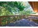 Spacious backyard deck area offering a tranquil outdoor space surrounded by trees at 838 Lake Hollow Sw Blvd, Marietta, GA 30064