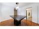 Dining room with a large table, wooden floors, and an open doorway to the entry way at 838 Lake Hollow Sw Blvd, Marietta, GA 30064