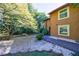 Exterior view of the home with a sprawling yard and mature trees at 838 Lake Hollow Sw Blvd, Marietta, GA 30064