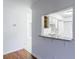 View to kitchen featuring granite counters and white cabinets at 838 Lake Hollow Sw Blvd, Marietta, GA 30064