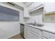 Stainless steel dishwasher and sink with white cabinets at 838 Lake Hollow Sw Blvd, Marietta, GA 30064