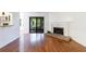 Open living room with fireplace and sliding glass doors to the outside at 838 Lake Hollow Sw Blvd, Marietta, GA 30064