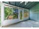 Covered porch with views of lush trees and partial shade at 838 Lake Hollow Sw Blvd, Marietta, GA 30064